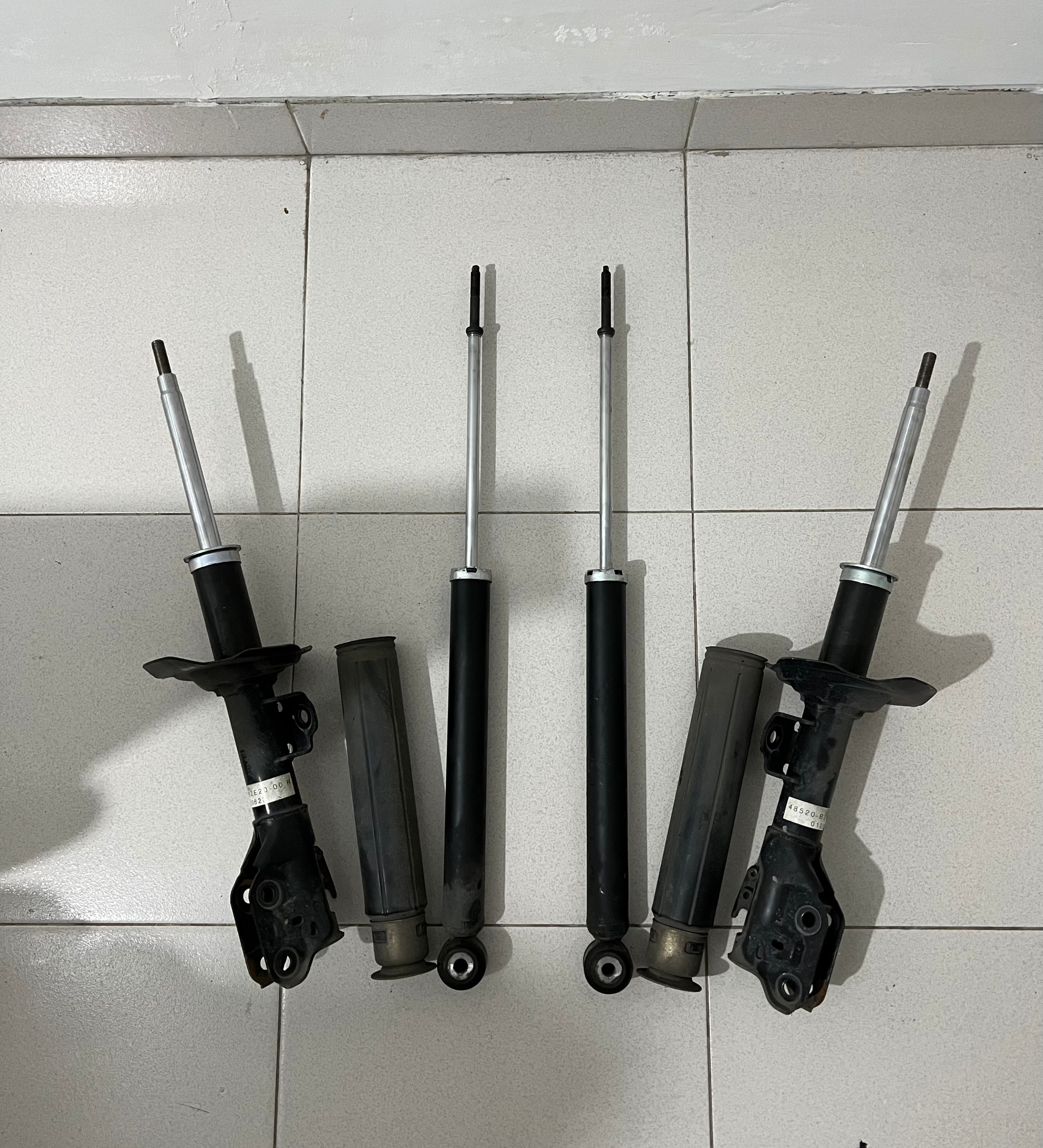 Suspension shock absorbers and struts